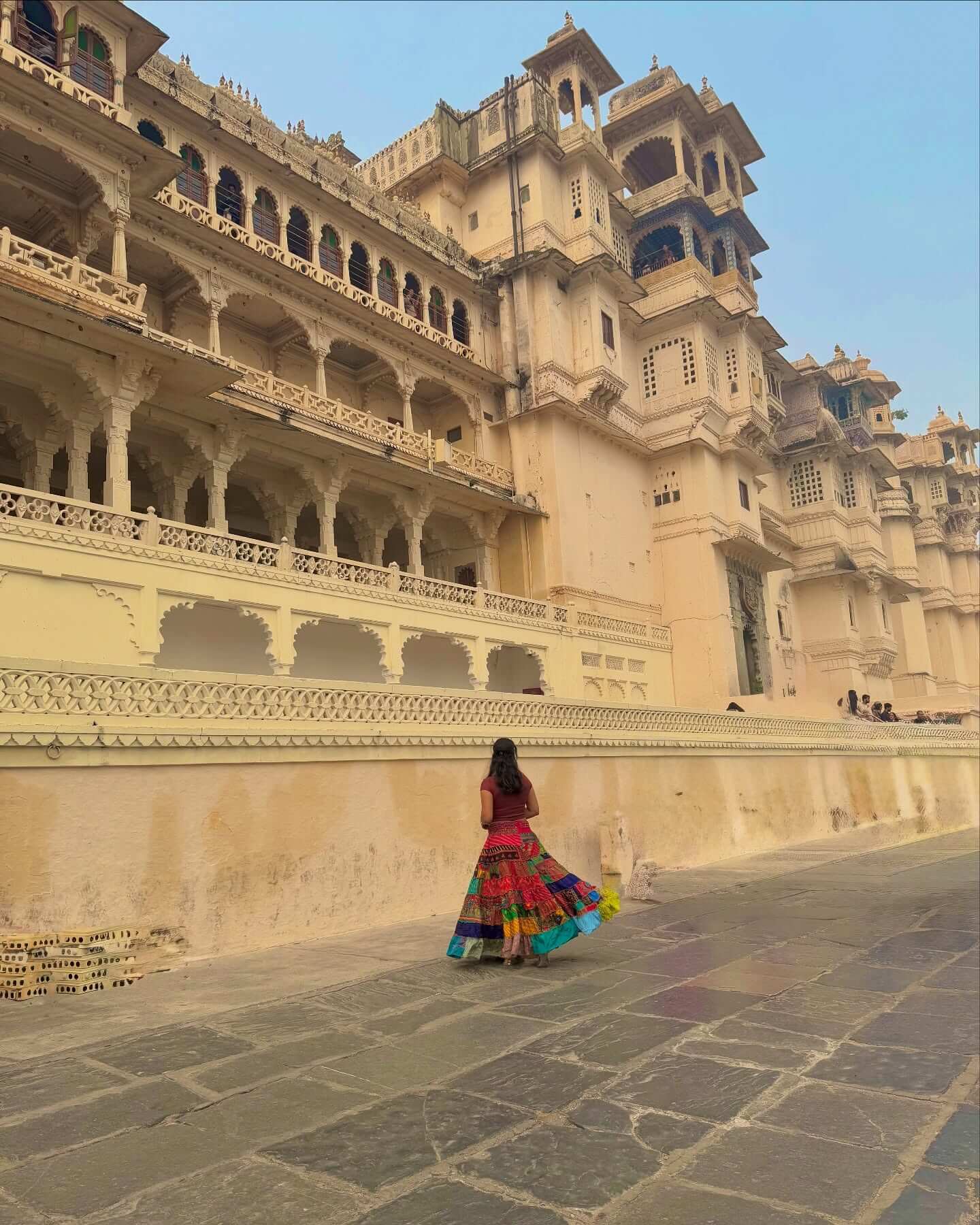 The magnificent white marble facade of the Udaipur City Palace complex overlooking Lake Pichola, a key historical site near Kumbhalgarh Fort.