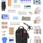 A red portable first aid kit box, clearly labeled with a white cross, sitting on a clean,