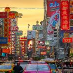 Aerial view of Bangkok city skyline showcasing temples and modern buildings – perfect for a budget Thailand trip from India