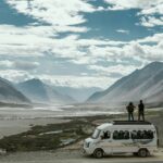 Ladakh tour package from Delhi – scenic view of Pangong Lake surrounded by mountains