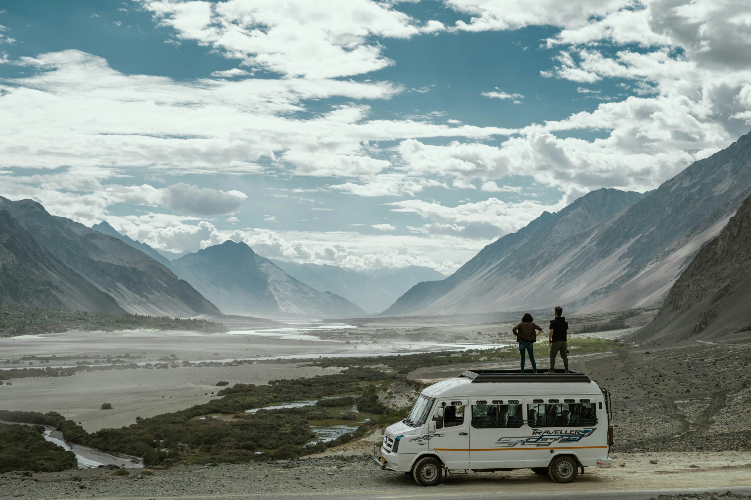 Ladakh tour package from Delhi – scenic view of Pangong Lake surrounded by mountains