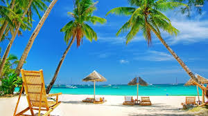 Tourists relaxing on a sunny beach in Goa during peak winter season.