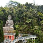 "The sleek Awana SkyWay gondola soaring above the majestic Malaysian jungle, offering a bird's-eye view."