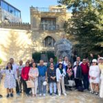 A collage of images from Azerbaijan, featuring a vibrant view of Baku's modern cityscape with the Flame Towers, a serene landscape of rural mountains, and a close-up of traditional food.