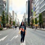 A collage of images of Japan, including a traditional geisha with a parasol, a high-speed bullet train, the vibrant nightlife of Tokyo, and a serene garden.
