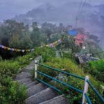 Scenic mountain view of Mussoorie hill station with clouds and Himalayan backdrop
