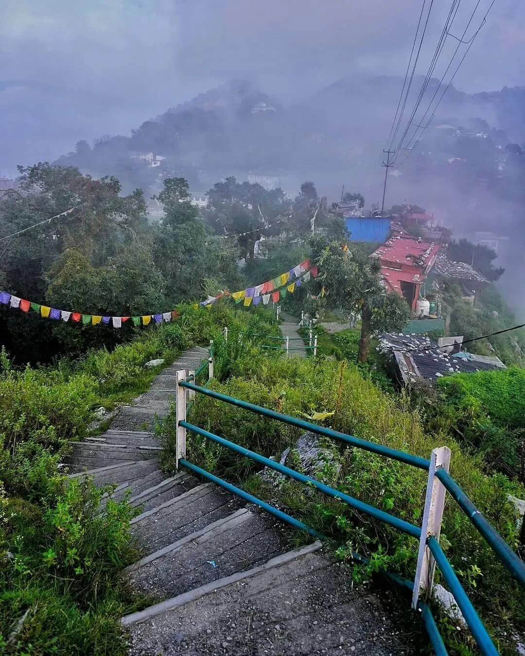 Scenic mountain view of Mussoorie hill station with clouds and Himalayan backdrop