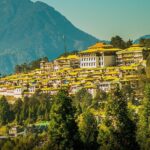 Panoramic view of Tawang Monastery surrounded by snow-covered mountains in Tawang tourist place, Arunachal Pradesh