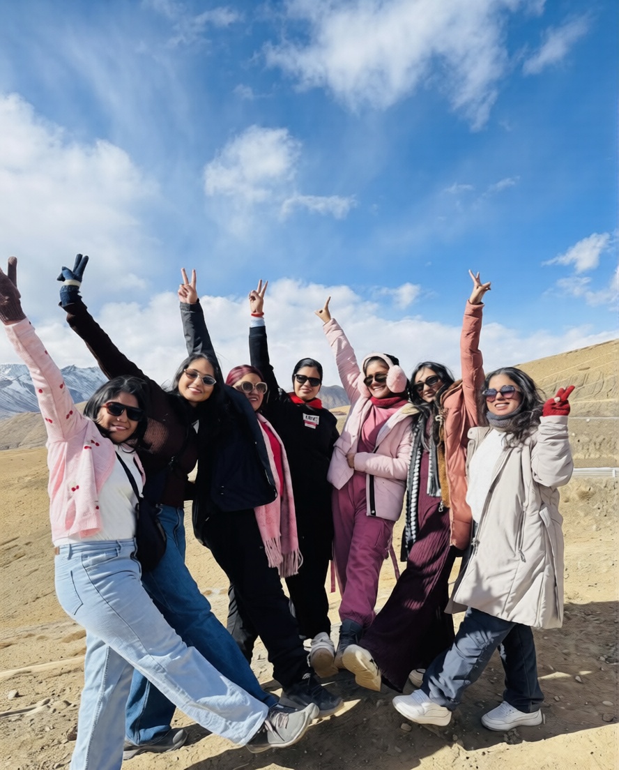 Travelers enjoying a scenic Spiti Valley trip with mountains, monasteries, and winding Himalayan roads