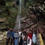 A scenic view of Jibhi, Tirthan Valley, and Shoja in Himachal Pradesh, featuring wooden cottages, lush pine forests, flowing rivers, and stunning Himalayan mountain landscapes.