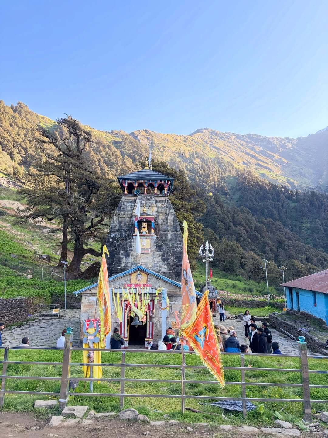 Madhyameshwar Temple surrounded by Himalayan mountains in Uttarakhand